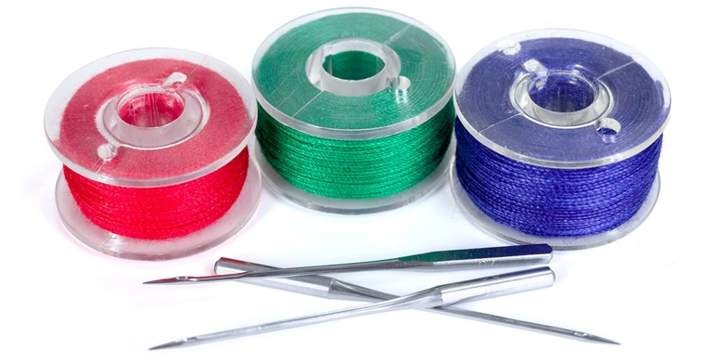 Bobbin thread and machine embroidery needles