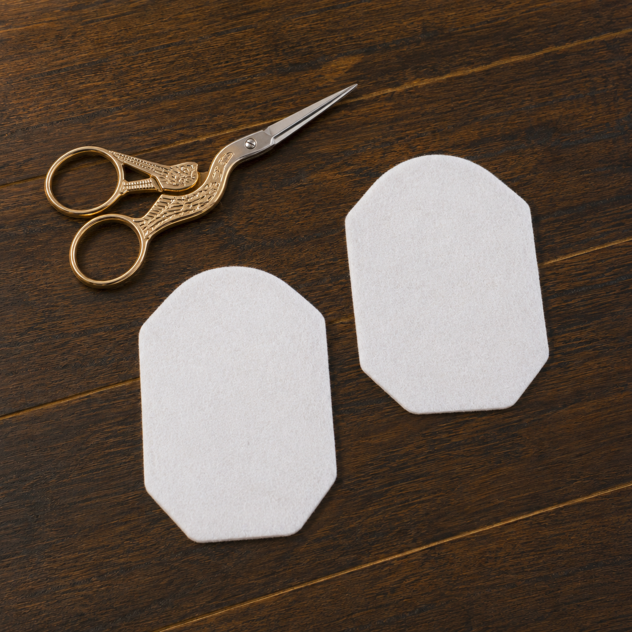 Two matching felt pieces cut for the front and back of an ITH ornament