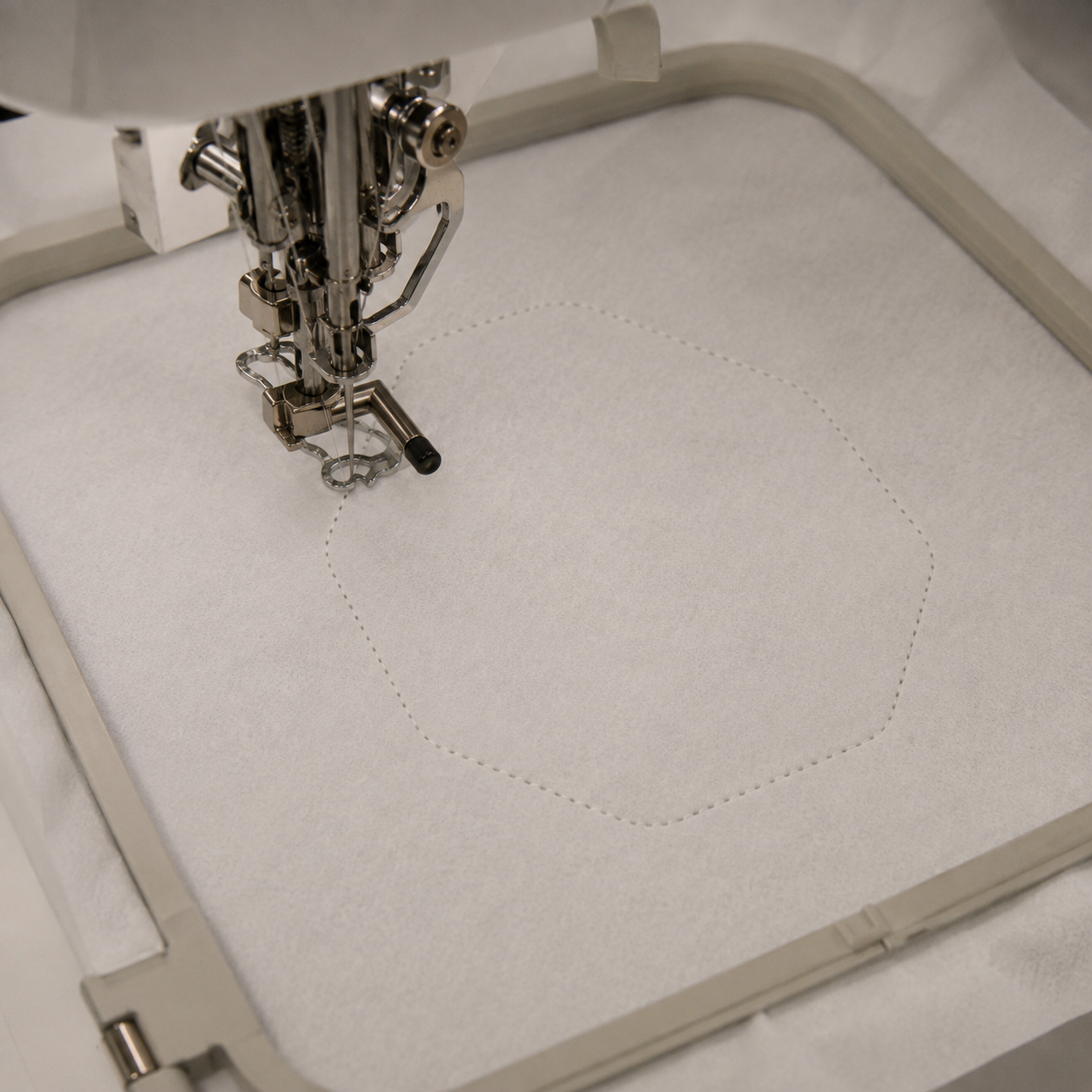 Placement line stitched on tear-away stabilizer for an in-the-hoop ornament