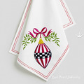 Checkered oblong Christmas toy with a bow