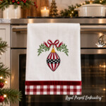 Checkered oblong Christmas toy with a bow